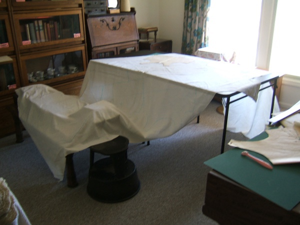 fabric draped over card table and coffee table