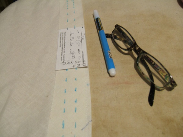 casing marked for stitching, with marking card, marker, and 
                     magnifying glasses
