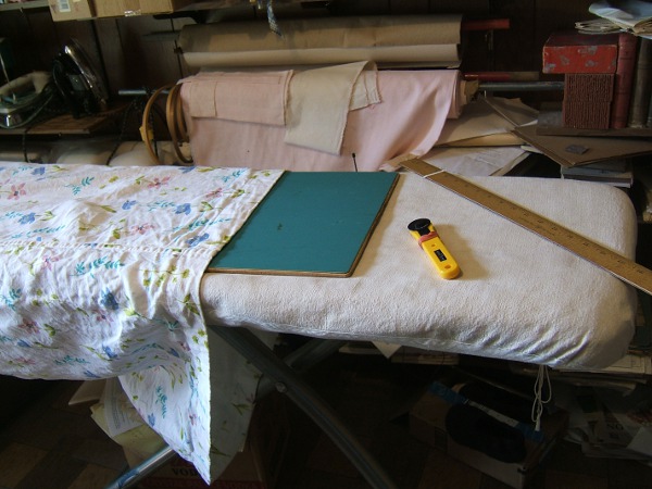 cutting mat, ready to shorten cotton-lined linen dress