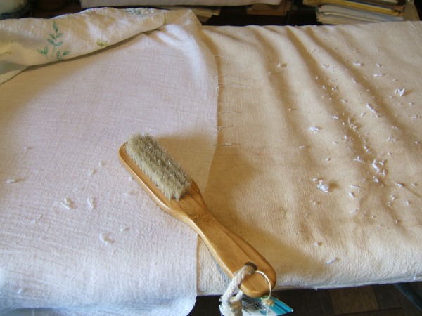 brushing lint out of the cotton-linen dress
