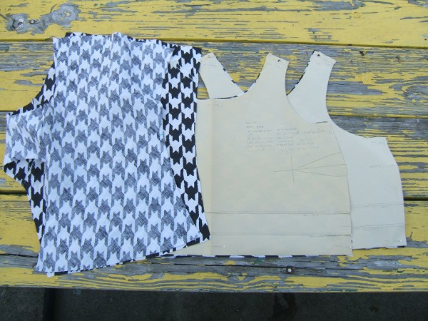 bra pieces and partly-sewn panties on picnic table