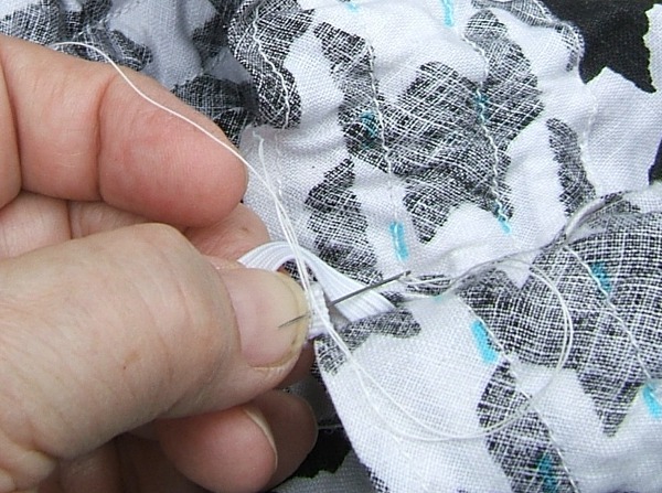 taking second stitch, thread obscures action