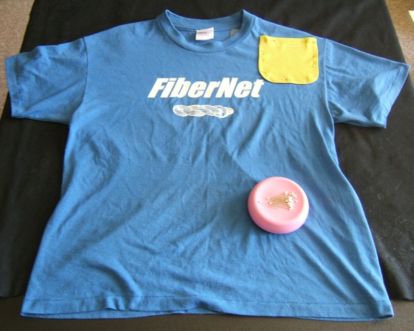FiberNet shirt on card table, with pocket pinned