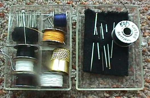 A sewing kit assembled in a four-compartment bobbin box