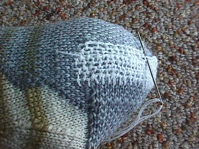 Interlocking rows of buttonhole stitch on the heel of a sock