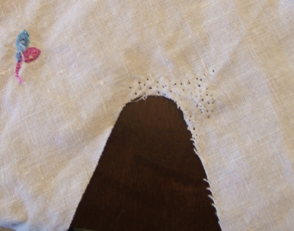 embroidery picked out of underarm