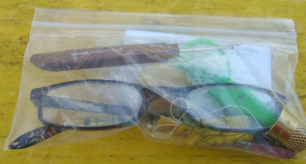 snack bag with glasses and other tools